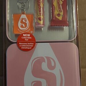 Starburst collectors tin with lip balm, lip gloss and keychain